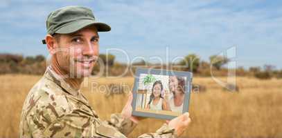 Composite image of soldier using tablet pc