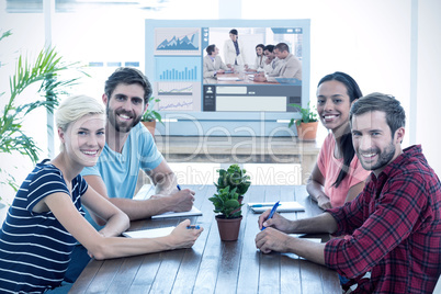 Composite image of friends sitting at a table