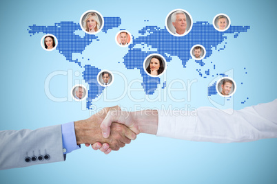 Composite image of business people shaking hands on white backgr