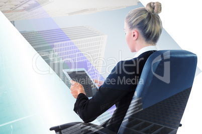 Composite image of businesswoman sitting on swivel chair with ta