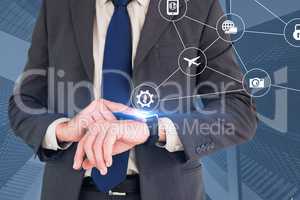 Composite image of businessman looking at watch