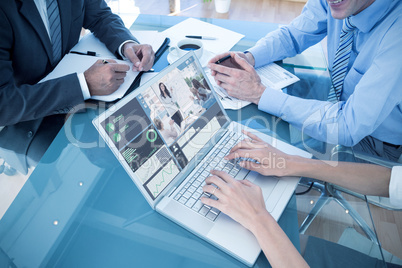 Composite image of business people in discussion in an office