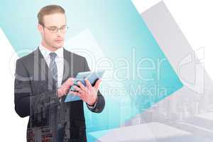 Composite image of unsmiling businessman using tablet pc