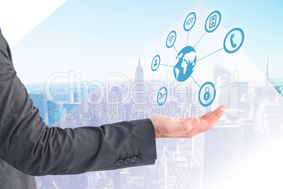 Composite image of businessman holding his hand out Composite image of businessman holding his hand out