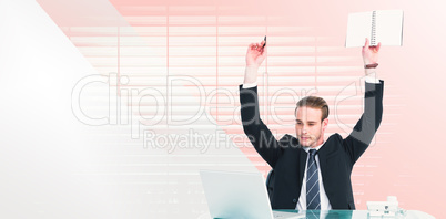 Composite image of businessman with arms up holding pencil and n