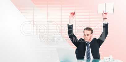 Composite image of businessman with arms up holding pencil and n