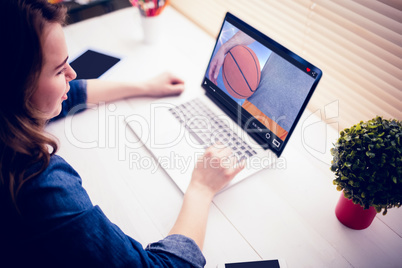 Composite image of man holding basket ball