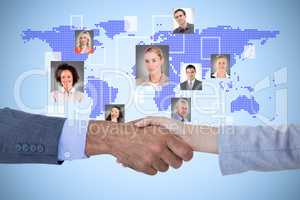Composite image of business people shaking hands on white backgr