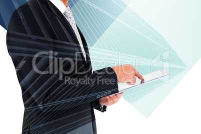 Composite image of businessman using his tablet pc