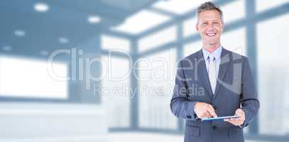 Composite image of portrait of smiling businessman using digital