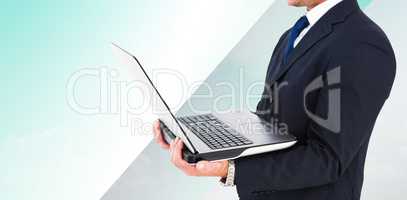 Composite image of businessman with watch using tablet pc