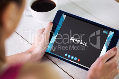 Composite image of woman using tablet pc