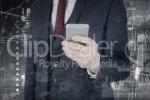 Composite image of  businessman using mobile phone