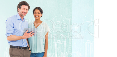 Composite image of portrait of smiling business people using tab