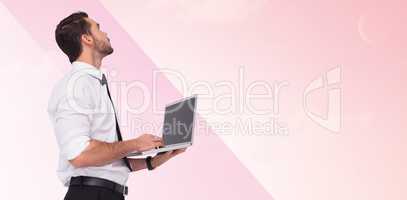 Composite image of sophisticated businessman standing using a la