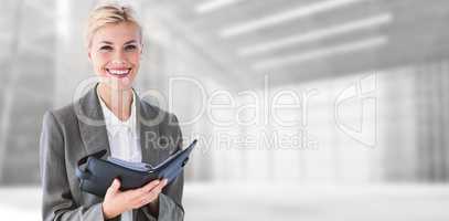 Composite image of businesswoman with diary