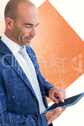 Composite image of businessman using a tablet