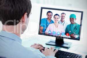 Composite image of portrait of a successful medical team at work