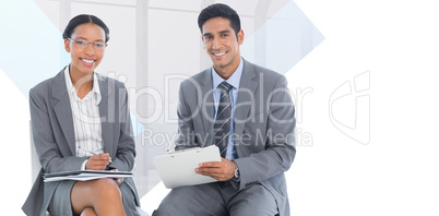 Composite image of portrait of smiling business people with pape