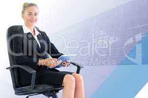 Composite image of businesswoman sitting on swivel chair with ta