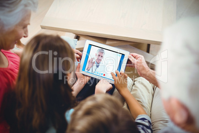 Composite image of happy doctor smiling at camera and showing hi