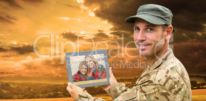 Composite image of soldier using tablet pc