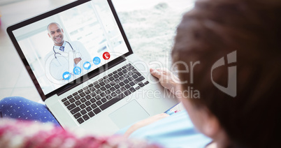 Composite image of pregnant woman using her laptop