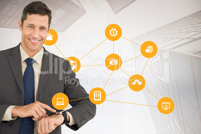 Composite image of businessman showing his watch