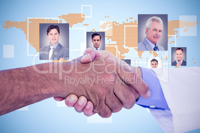 Composite image of business people shaking hands on white backgr