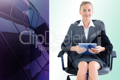 Composite image of businesswoman sitting on swivel chair with ta