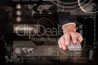 Composite image of businessman in suit using mouse