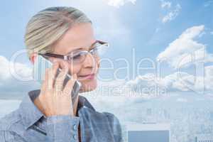 Composite image of businesswoman having a phone call