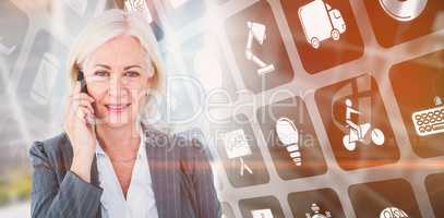 Composite image of portrait of businesswoman talking on mobile p