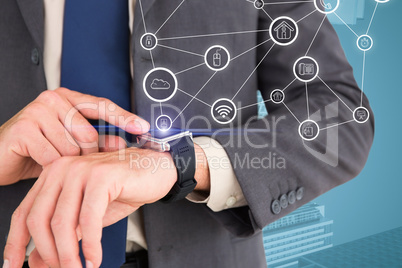 Composite image of businessman looking at watch