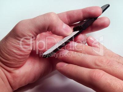 grooming of nails on a man's hand