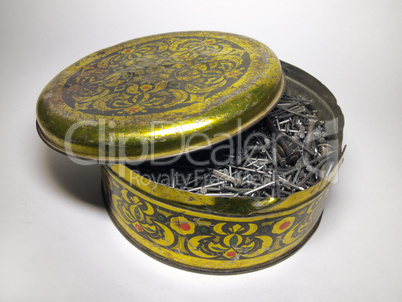 Vintage round tin box full of Shoe nails