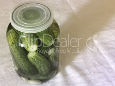 Pickled cucumbers. Prepare for canning in the big glass jar