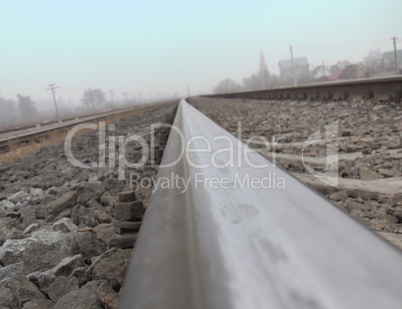 Rails, stretching to the horizon, photographed by a camera, plac