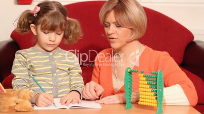 little girl and mother homework