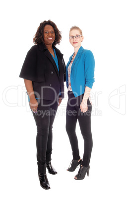 Two woman standing and smiling.
