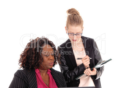 Closeup of two businesswoman working.