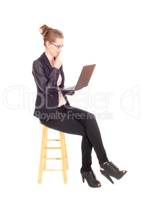 Business woman with laptop sitting.