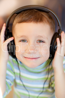 the child listens to music via earphones