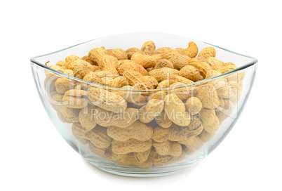crude peanuts isolated on white background
