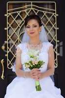 Brunette bride in a beautiful white dress