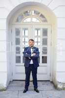 Unshaven groom in a blue suit