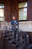 Unshaven groom in a blue suit