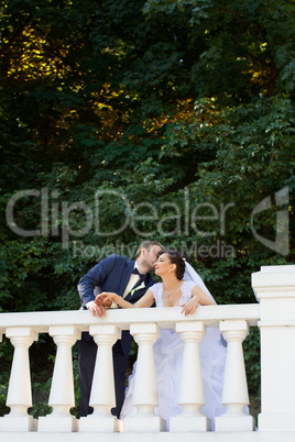 Groom in white shirt kissing bride hand. Very gentle photo