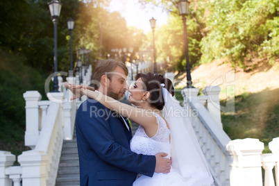 Groom in white shirt kissing bride hand. Very gentle photo