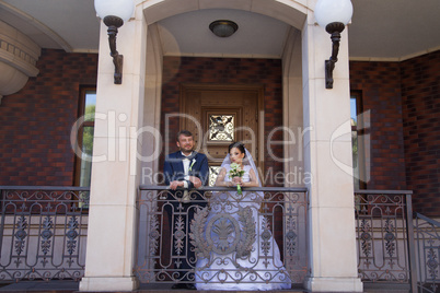 Wedding newlyweds kiss on a sunny day